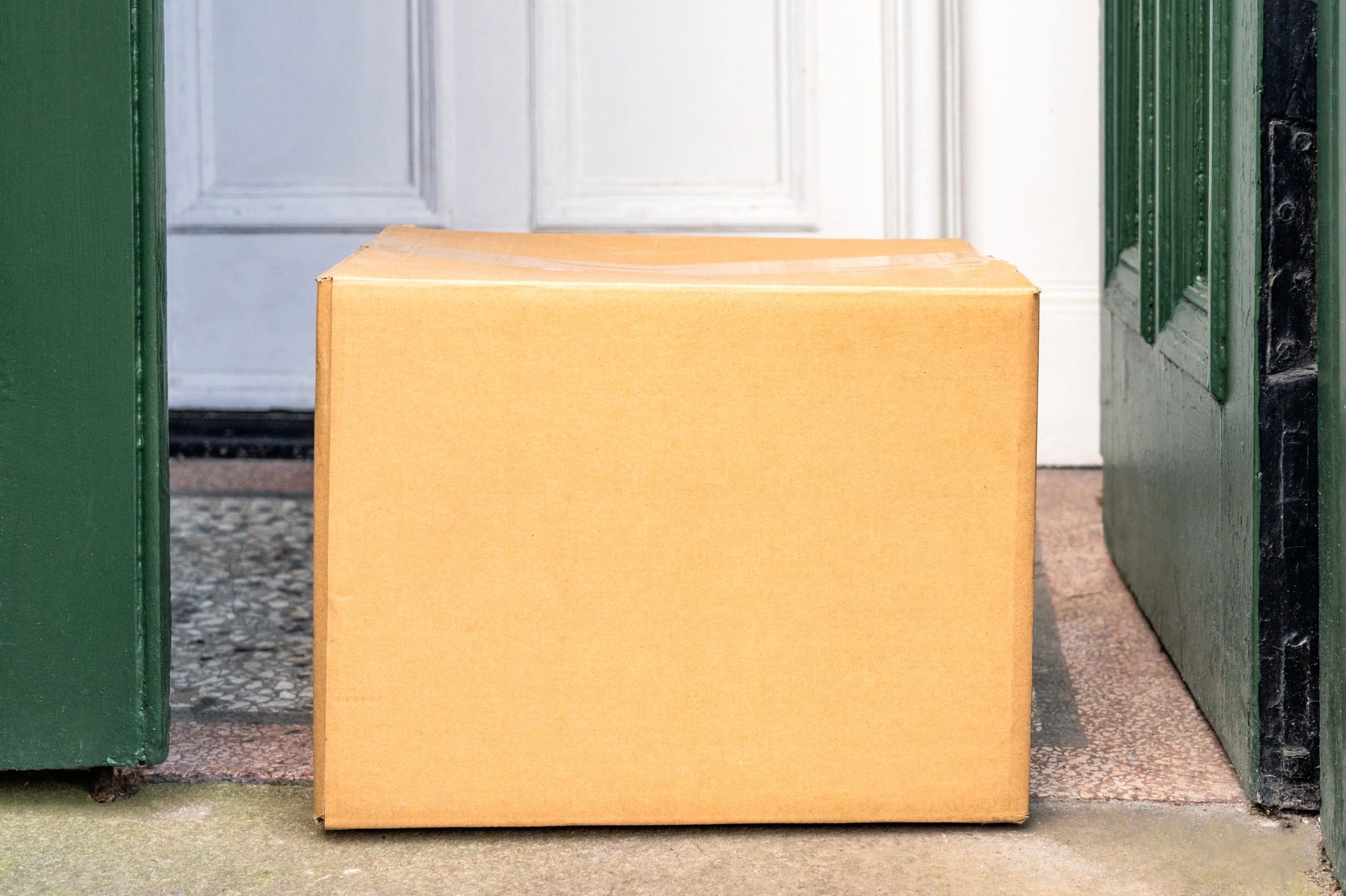 Delivered cardboard box on a front porch