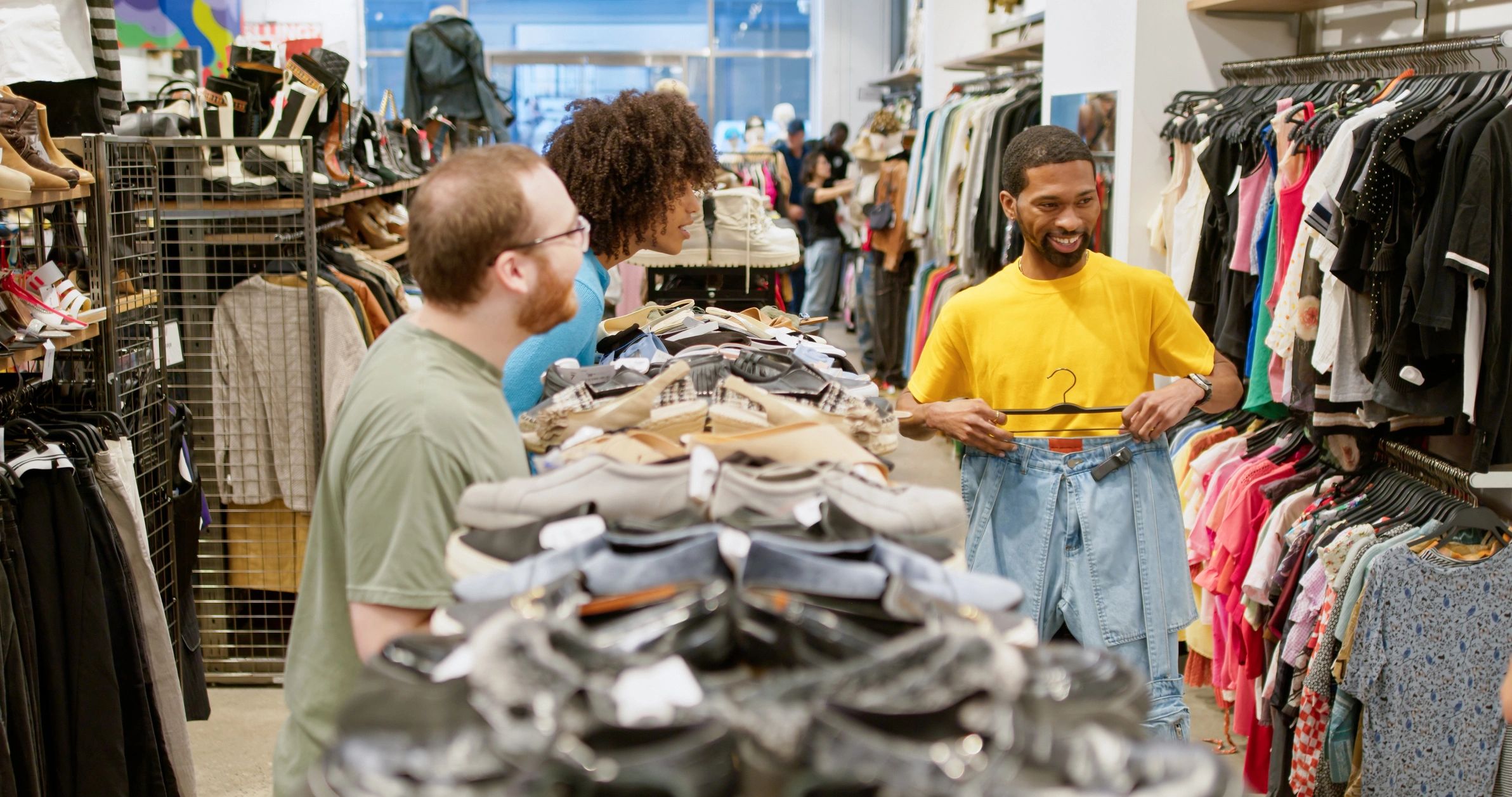 Customers browsing clothing in a boutique store