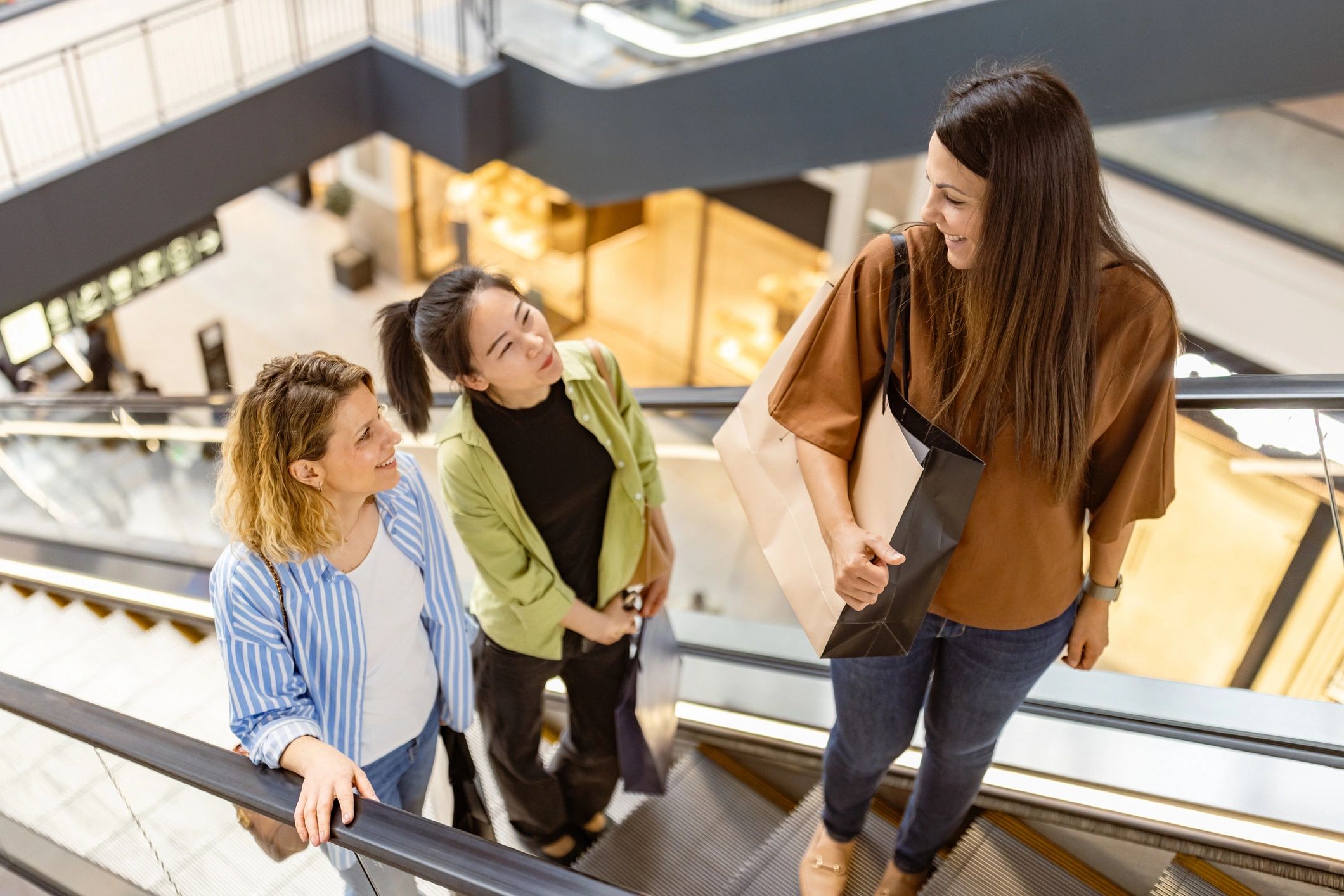 Friends shopping together in a bright mall